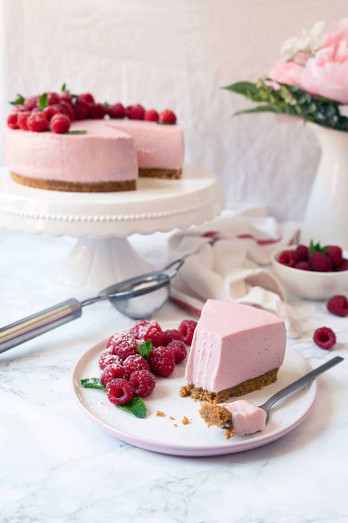 A served portion of no-bake raspberry cheesecake