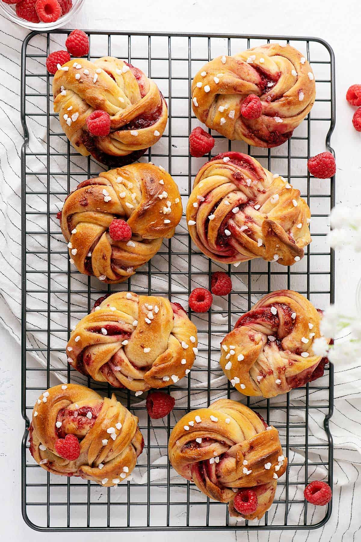 overhead view raspberry twisted buns.