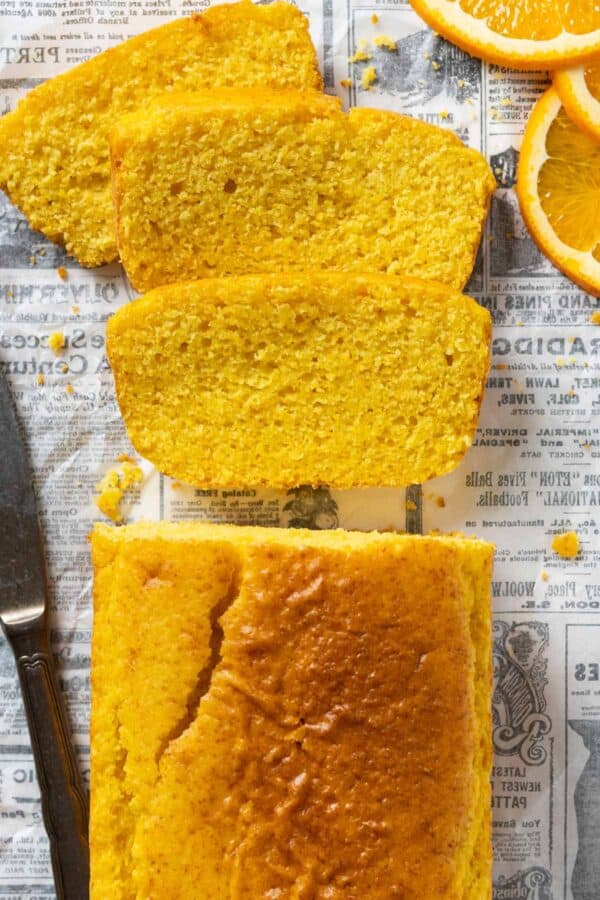 slices of orange cake on a table.