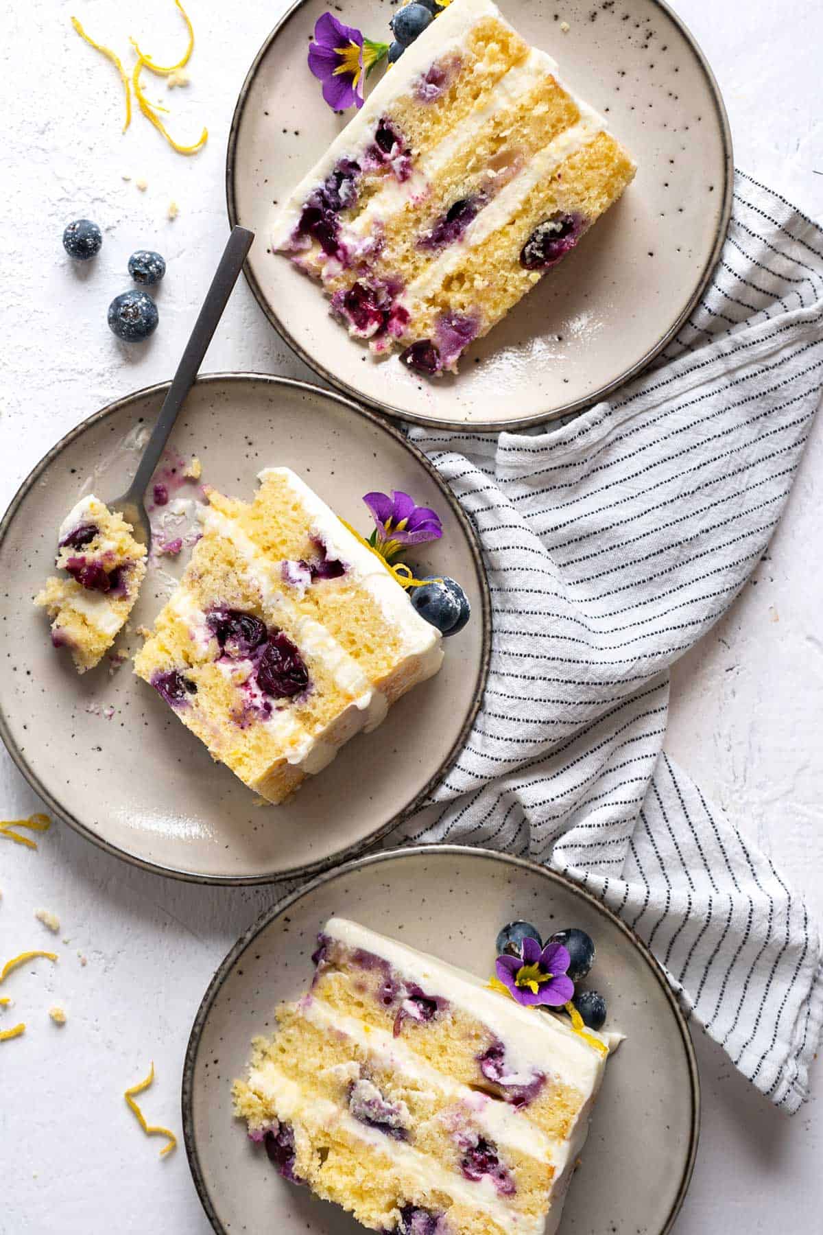 Three slices of cake in individual plates.