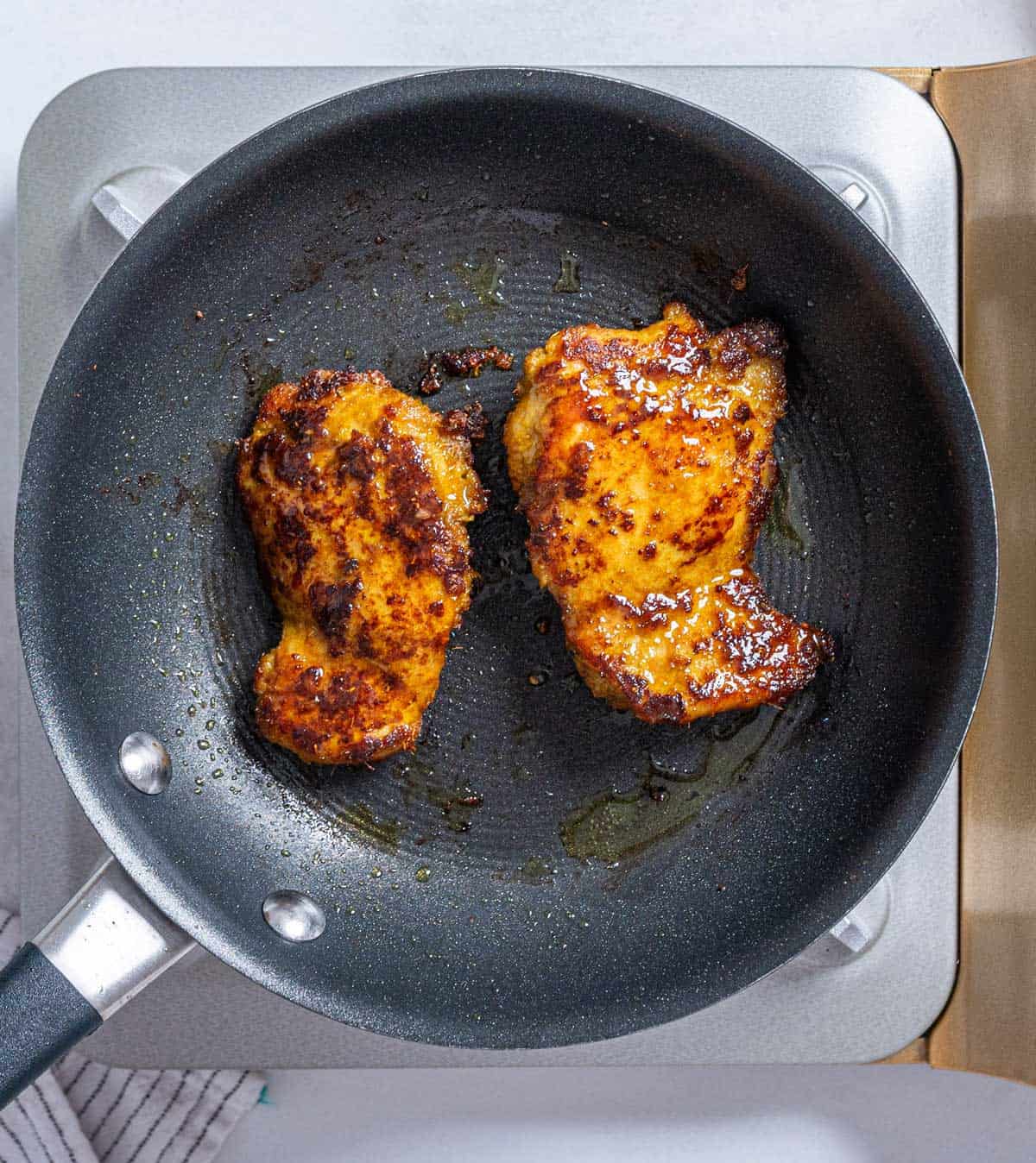 Cooking satay in a pan.