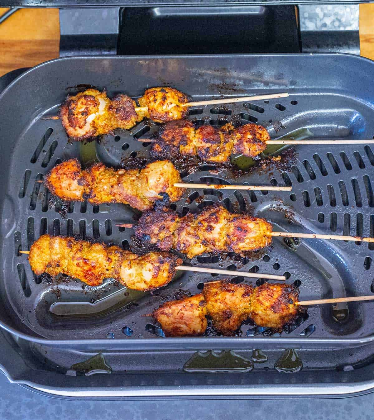 Cooking satay in an air-fryer.