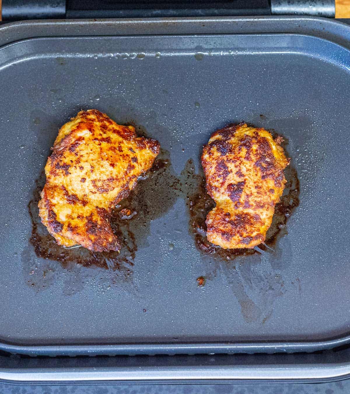 Grilling chicken satay.