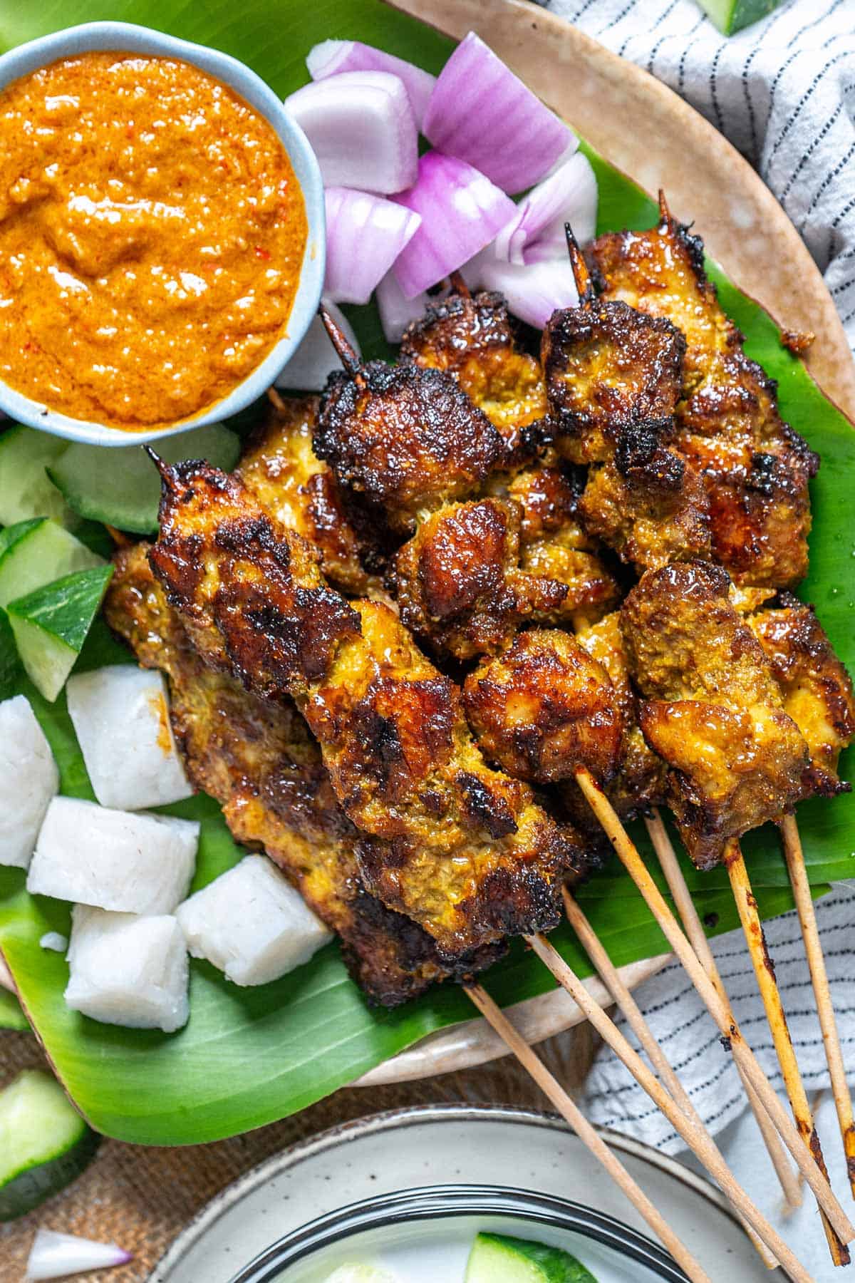 Malaysian chicken satay served with its condiments.