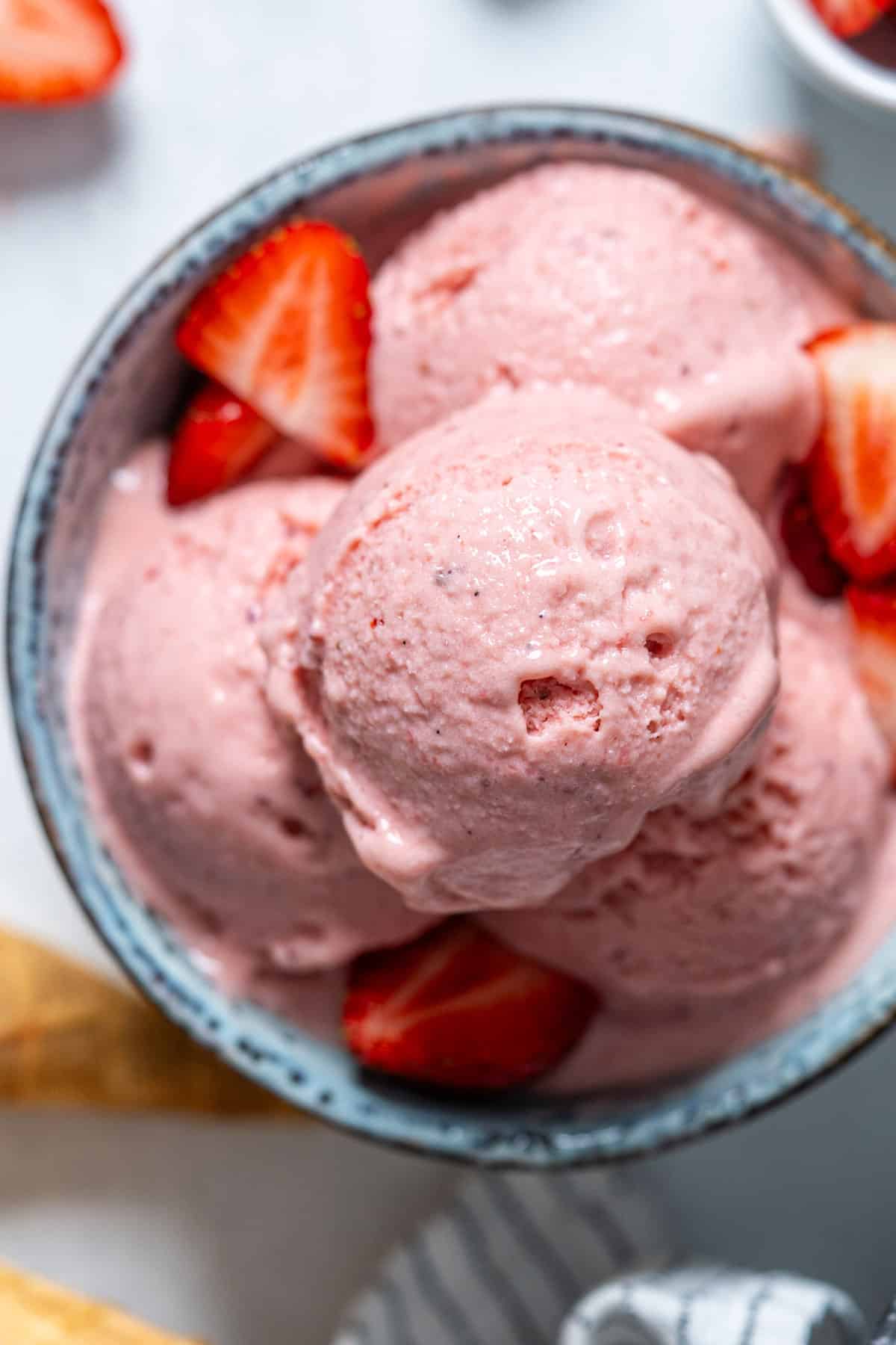 Scooped ice cream in a bowl.