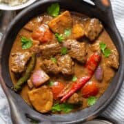 A beef stew served on a bowl.