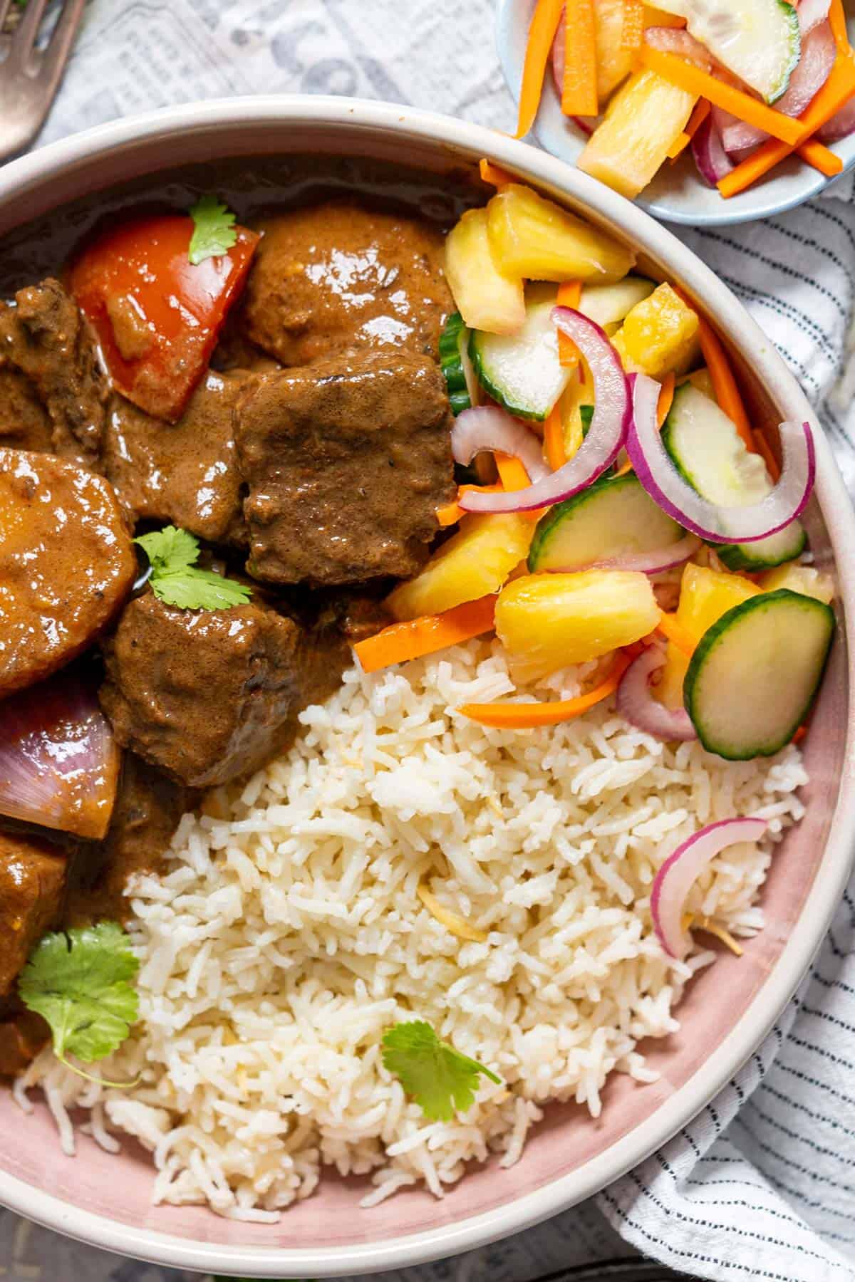 Beef korma with Asian cucumber and pineapple salad.