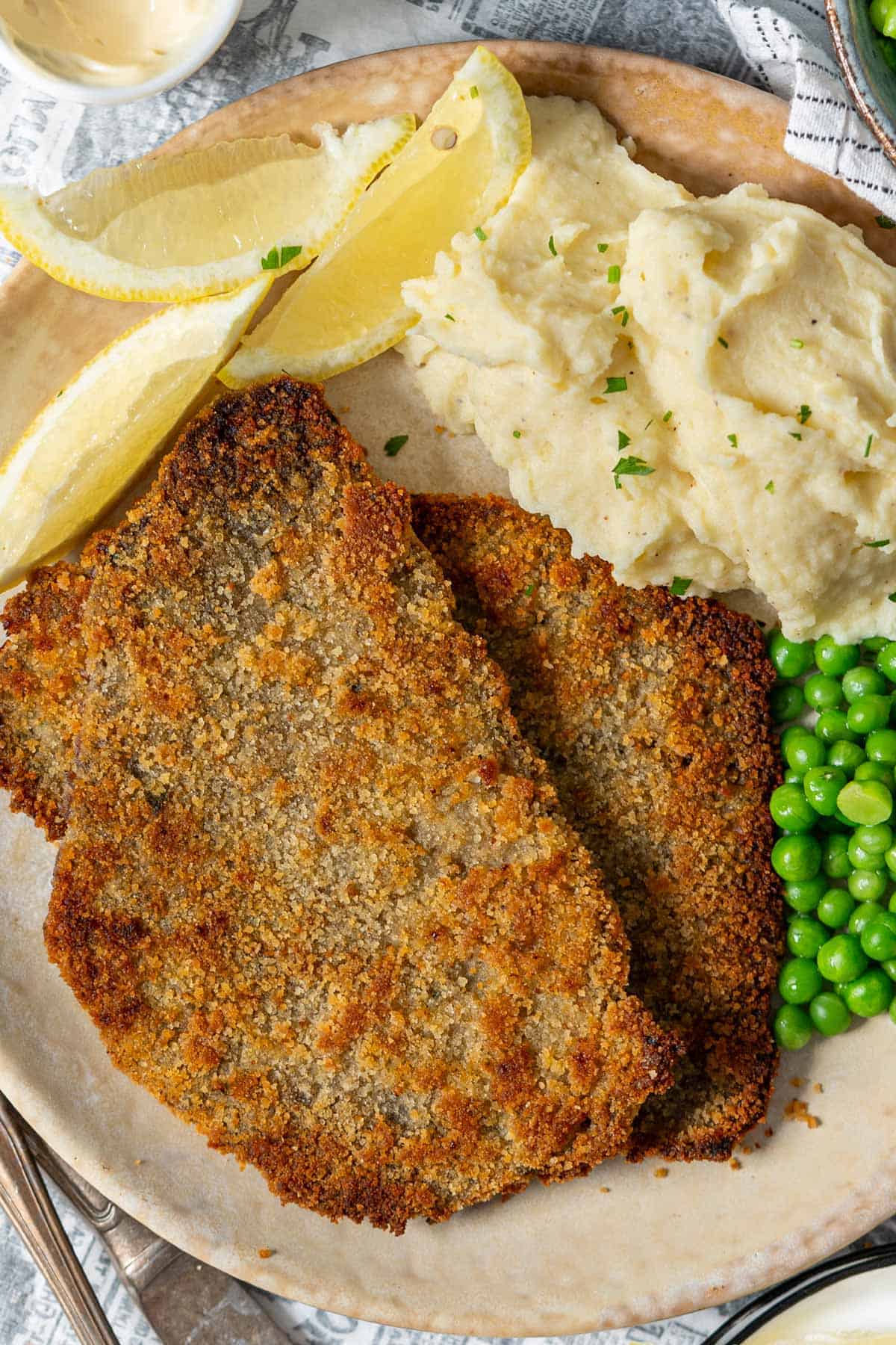 Milanesa steak served with side dishes.