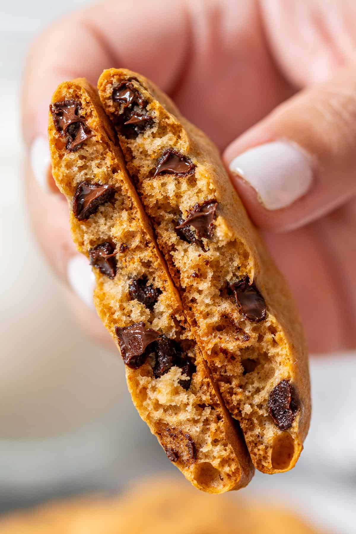 Showing the inside texture of healthy choc chip cookies.