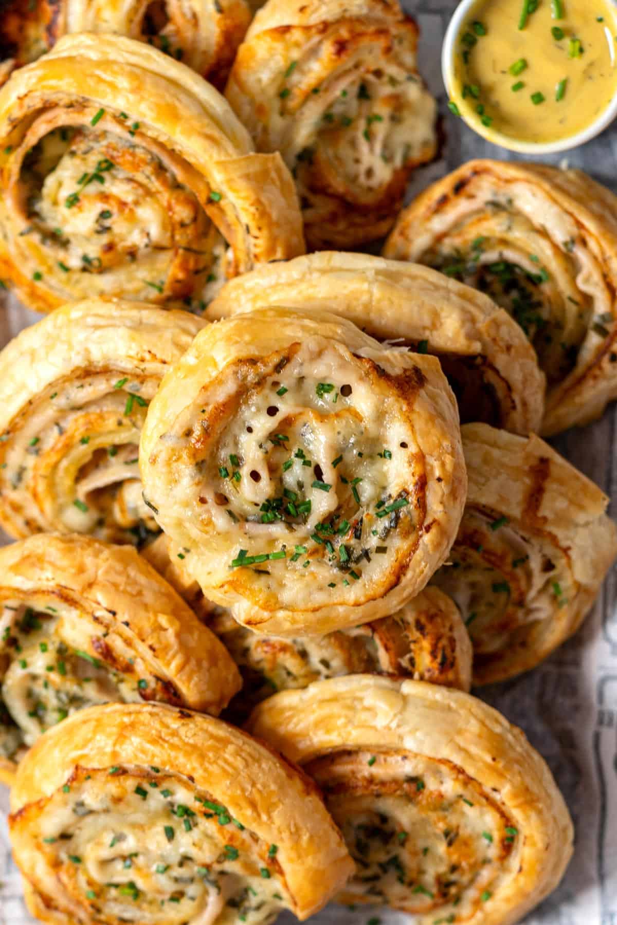 Puff pastry pinwheels served with honey mustard.